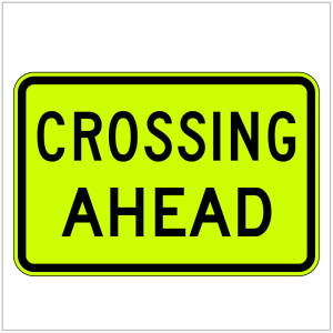 W8-22 – Green CROSSING AHEAD - WARNING SIGN in black text produced by ASAP Signs