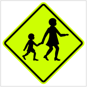 W6-3 – A yellow green pedestrian crossing sign featuring a woman and child, alerting drivers to watch for crossing pedestrians produced by ASAP Signs