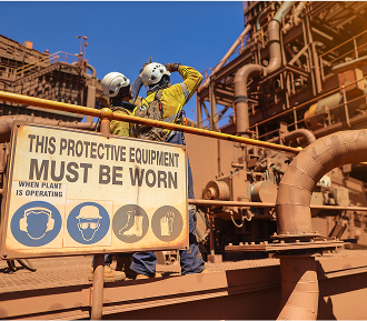 A caution sign indicating this location is hazardous for workers, provided by a supplier of hazard signs